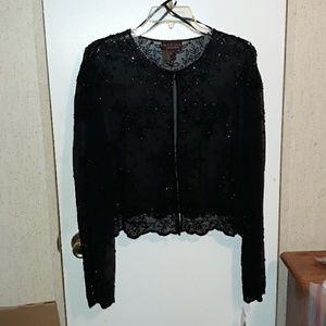 Black shear beaded long sleeve evening jacket.